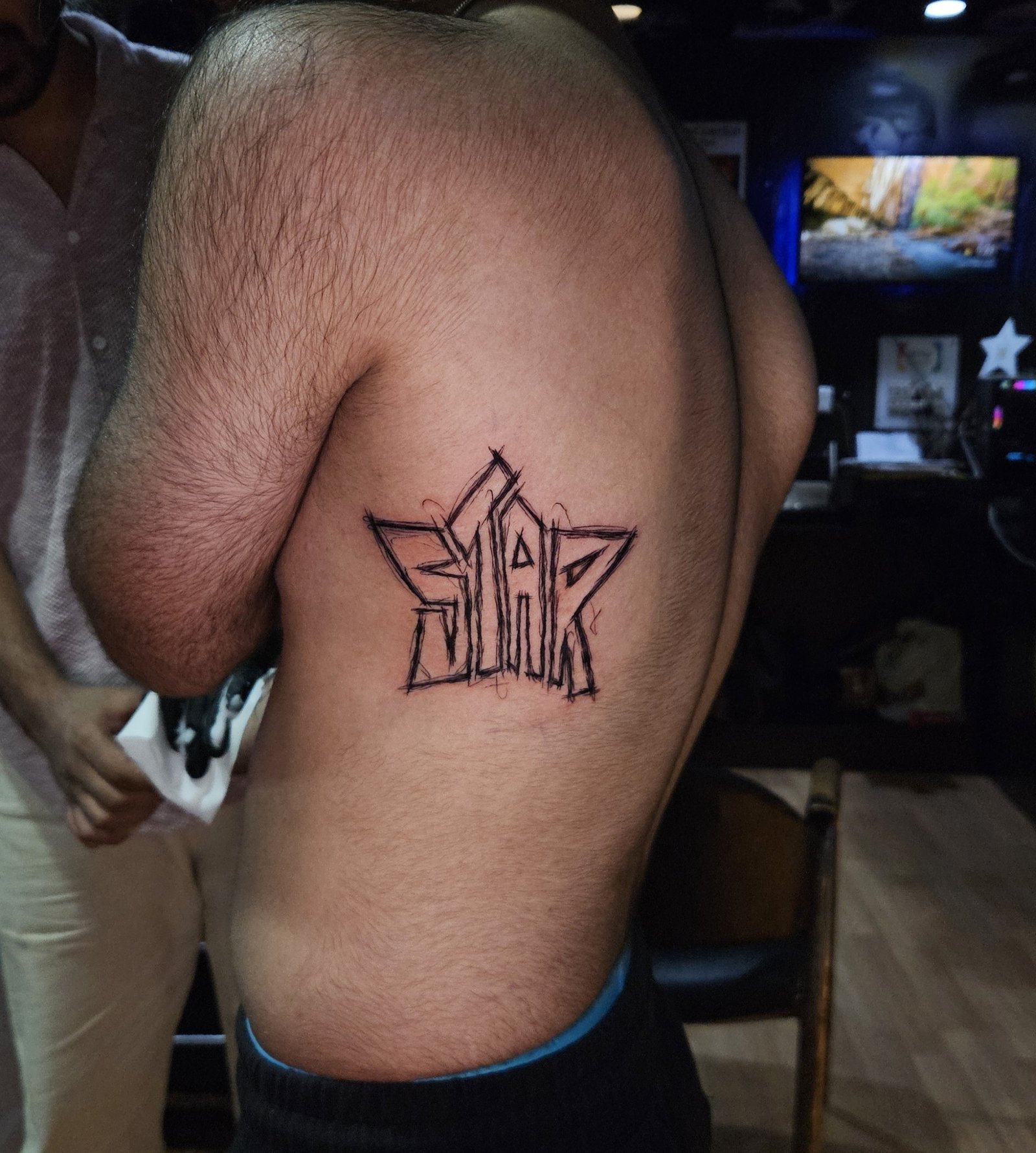 Custom Sketch-Style Star Tattoo: Precision Linework in Kamla Nagar